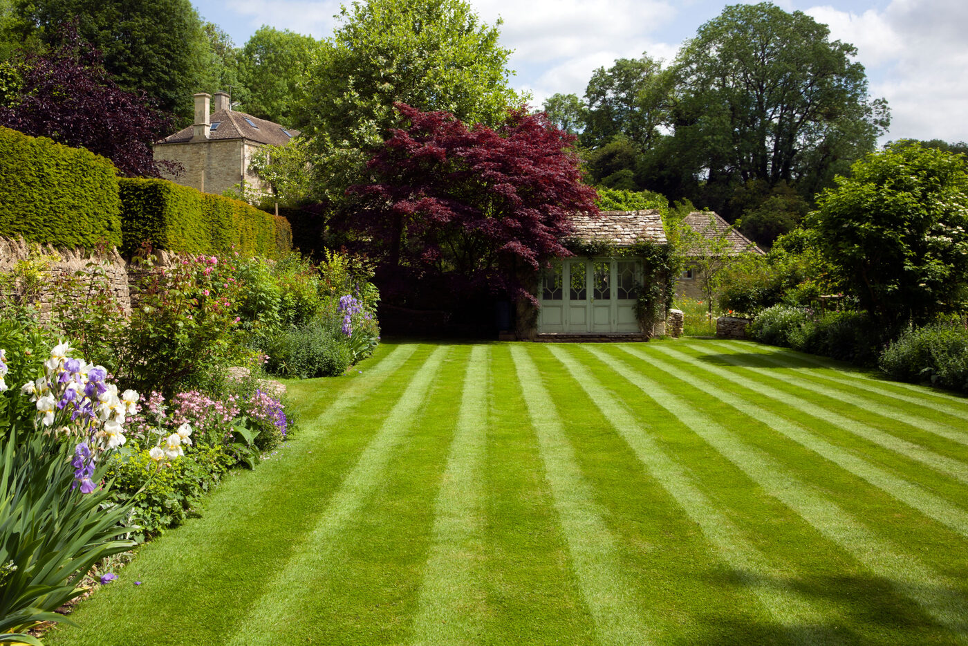 Immaculately striped and mown English lawn